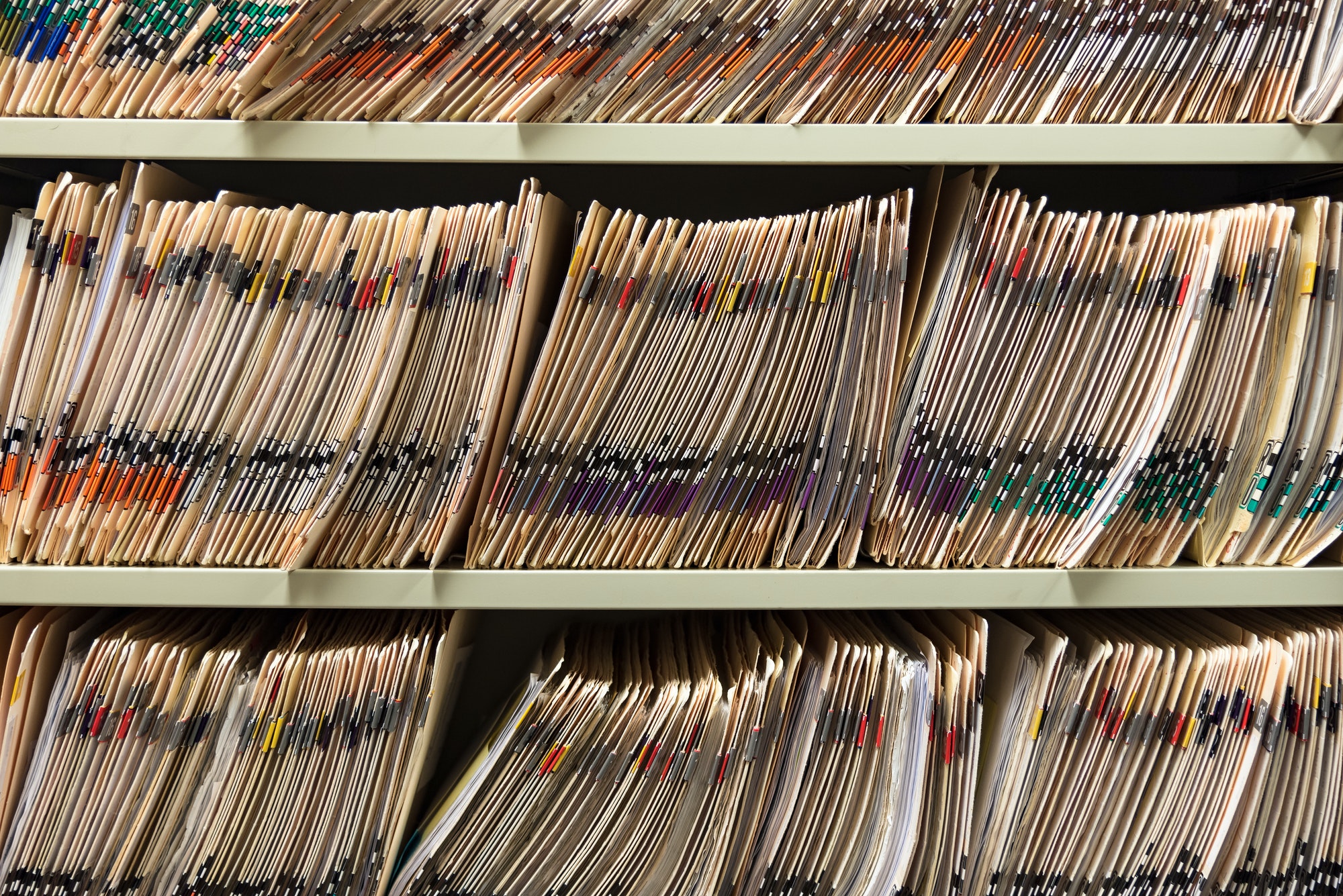Medical records, medical charts, paper charts in a stack